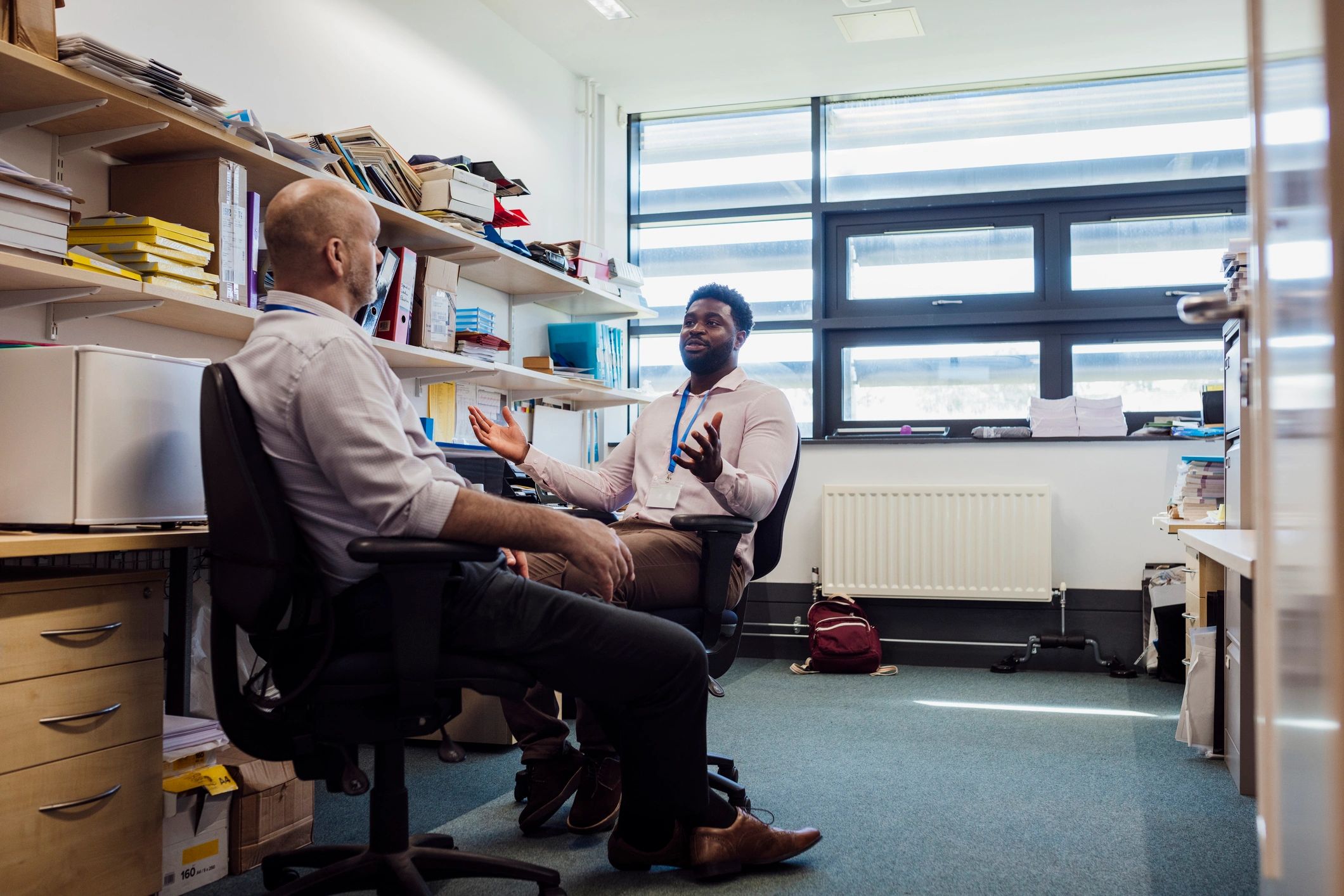 Two professionals in a focused consultation