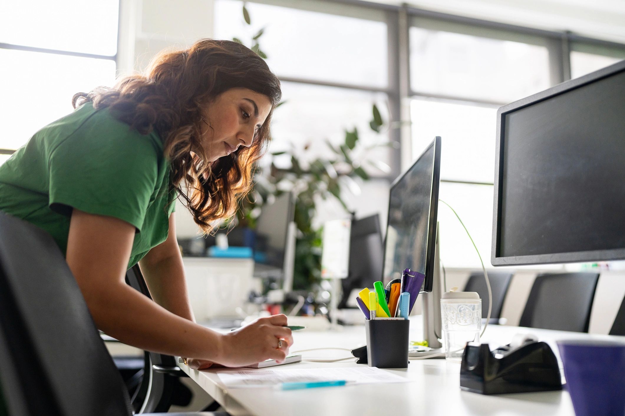 Professional reviewing career planning documents at a desk