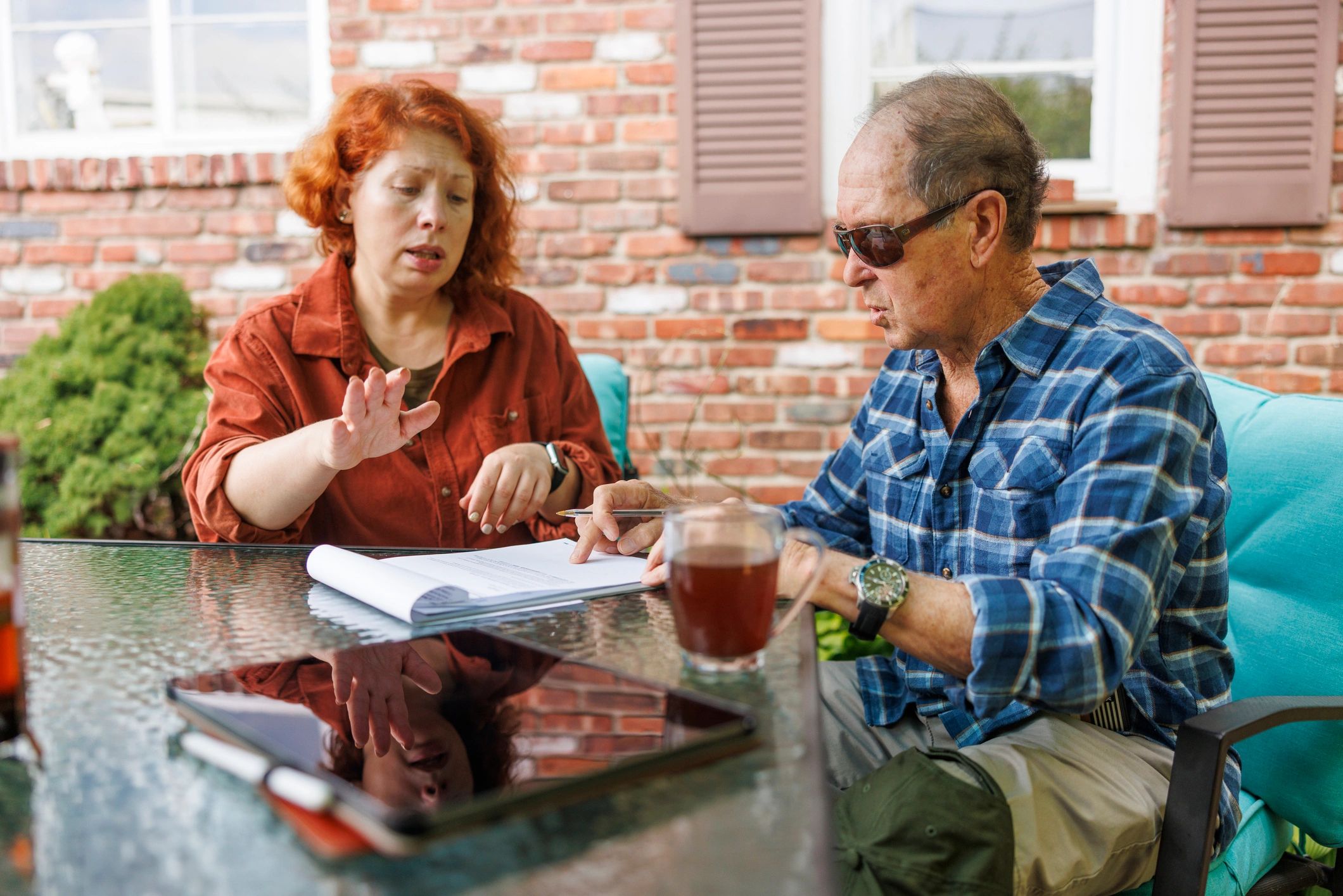 Consultant and client reviewing financial planning documents